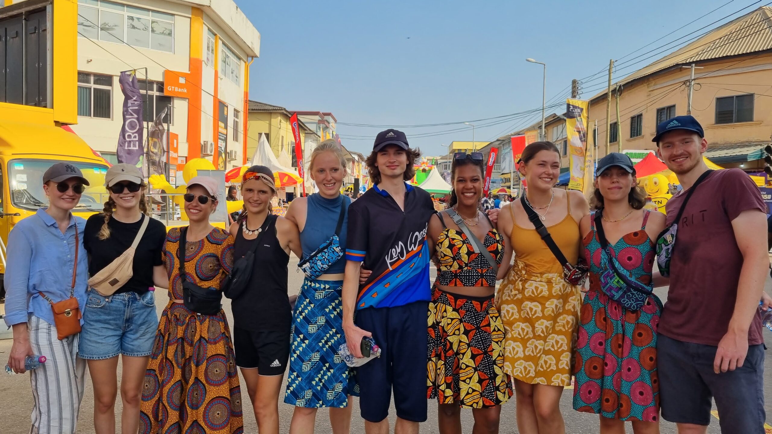 International students in traditional African clothing exploring Lagos